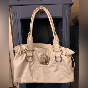 Well loved white hand bag.